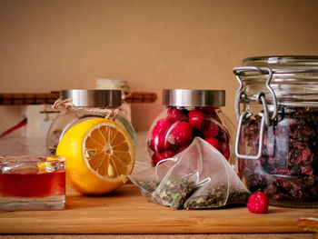 Close-up of fruits in glass jar on table