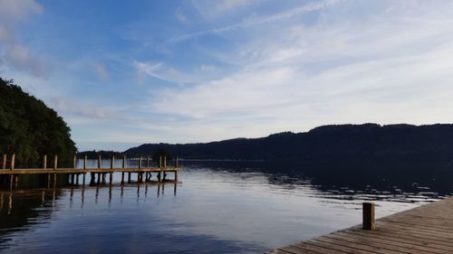 Pier over lake against sky