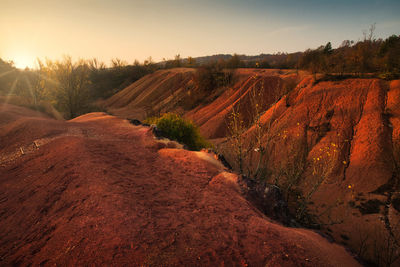 Scenic view of landscape against sky during sunset