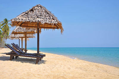 Sun loungers on calm beach