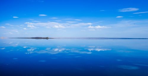 View of calm sea against blue sky