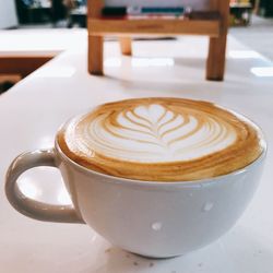 Close-up of cappuccino on table