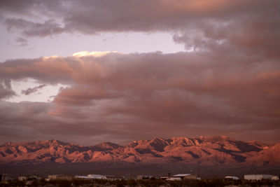 Scenic view of snowcapped mountains against sky during sunset