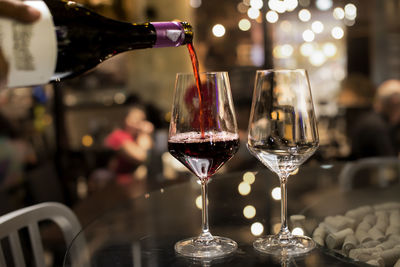 Close-up of wine glasses on table