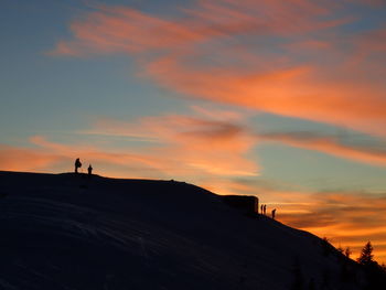 Scenic view of silhouette mountains against sky during sunset