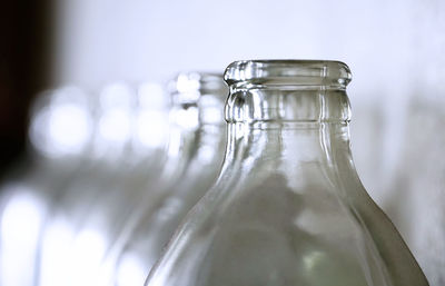 Close-up of glass bottle against white background