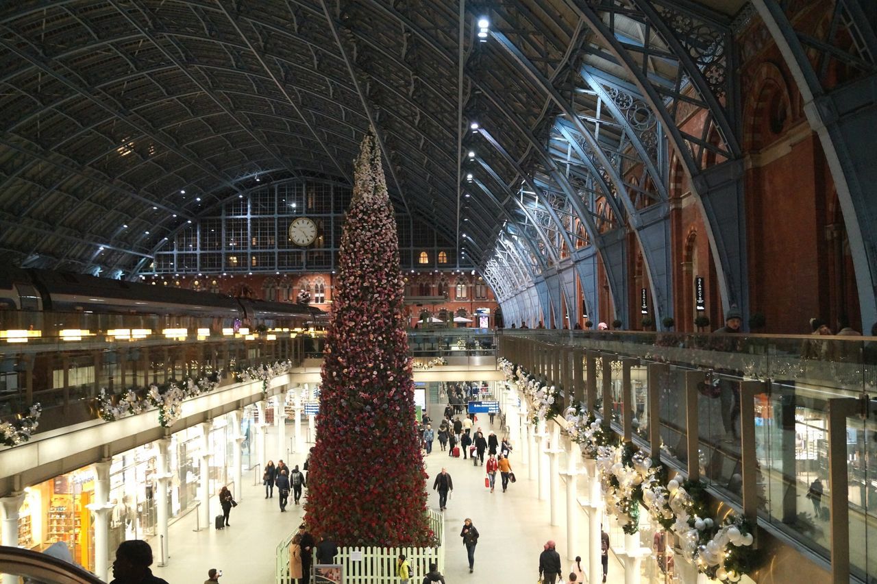 large group of people, built structure, real people, architecture, illuminated, indoors, lifestyles, crowd, men, women, leisure activity, railroad station, travel destinations, day, people, adult