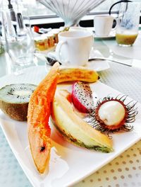 High angle view of fruits served on table in restaurant