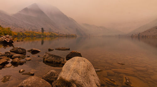 Sunrise at convict lake through smoke from the creek fire.