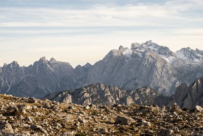 Scenic view of mountains against cloudy sky