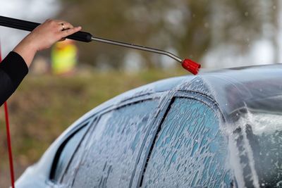 Close-up of person holding umbrella