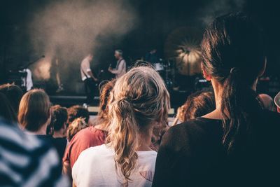 Rear view of crowd enjoying music concert