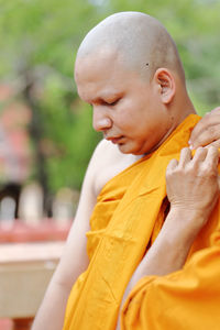 Monk during ordination ceremony at temple