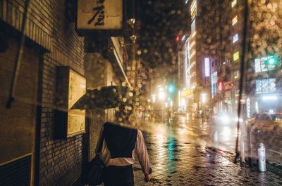 Illuminated city street at night