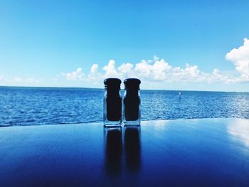 Scenic view of sea against blue sky