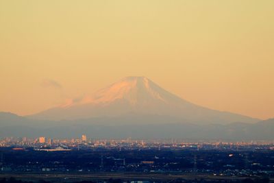 Scenic view of mountains against clear sky during sunset