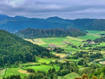 Scenic view of agricultural field against sky