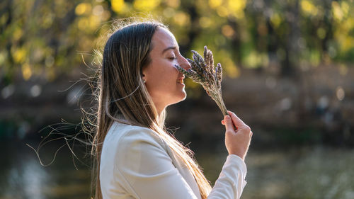 Woman smelling lavander for a spiritual ritual