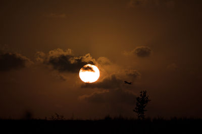 Scenic view of moon against sky at sunset