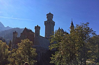 Low angle view of church against blue sky