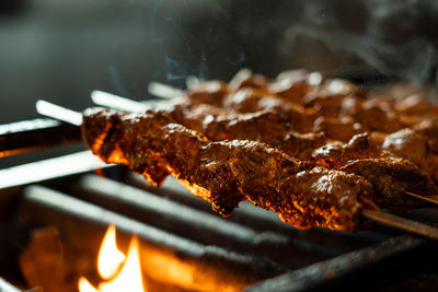 Close-up of meat on barbecue grill
