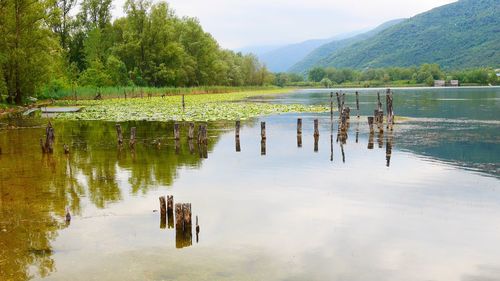 Scenic view of lake and mountains against sky