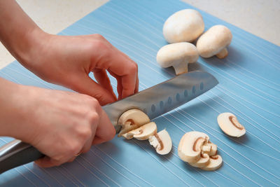 High angle view of person preparing food on table