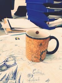 Close-up of coffee cup on table