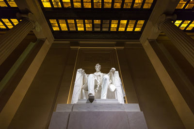 Low angle view of statue against ceiling