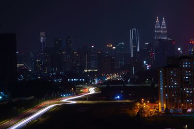 Illuminated buildings in city at night