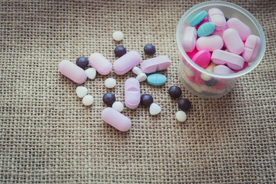 High angle view of multi colored candies on table