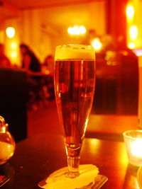 Close-up of wine glasses on table