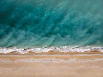 View of beach against cloudy sky