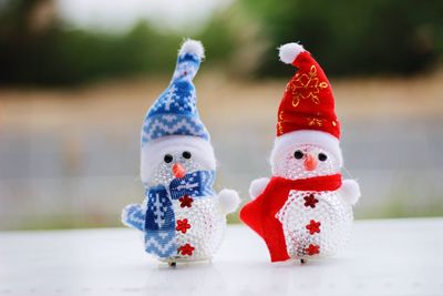 Close-up of stuffed toy on snow during winter