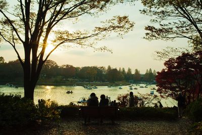 Scenic view of calm lake at sunset