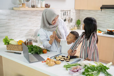 High angle view of people having food at home