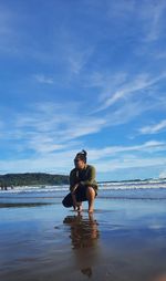 Full length of man on beach against sky