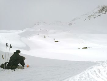 Scenic view of snow covered mountain against sky