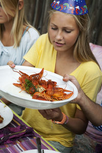 Teenage girl at crayfish party, sweden