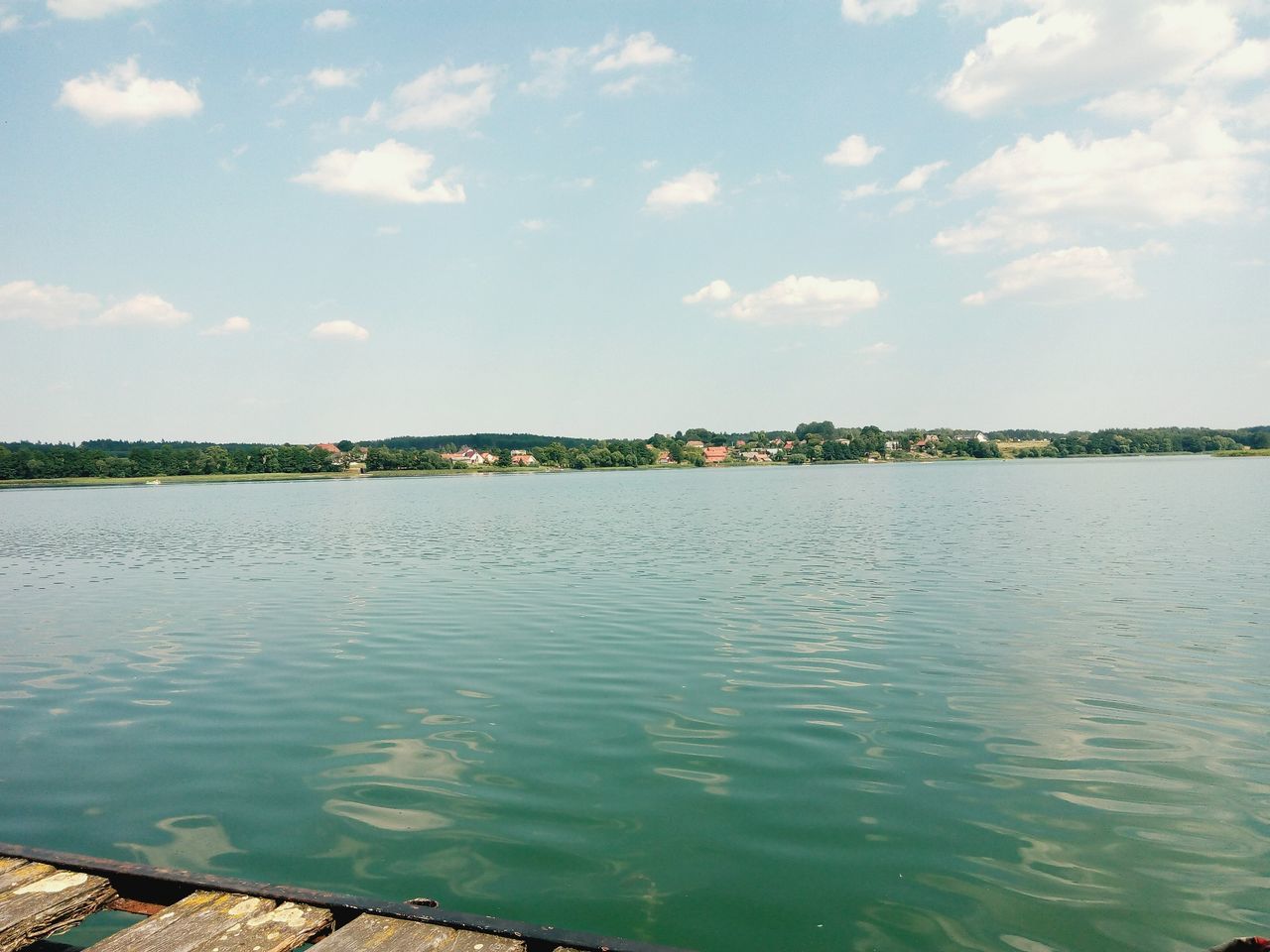 water, sky, tranquil scene, tranquility, scenics, cloud - sky, nature, beauty in nature, lake, cloud, rippled, bird, reflection, day, sea, river, idyllic, outdoors, waterfront, no people