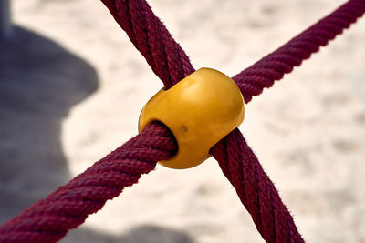 Close-up of rope on water against sky