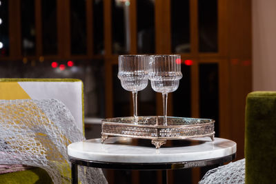 Close-up of wine glasses on table