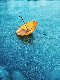 High angle view of yellow boat in water