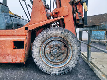 Close-up front wheel of old forklift truck