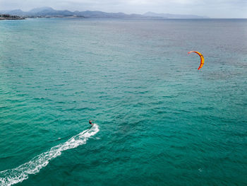 High angle view of people by sea against sky