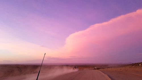 Scenic view of road against sky during sunset