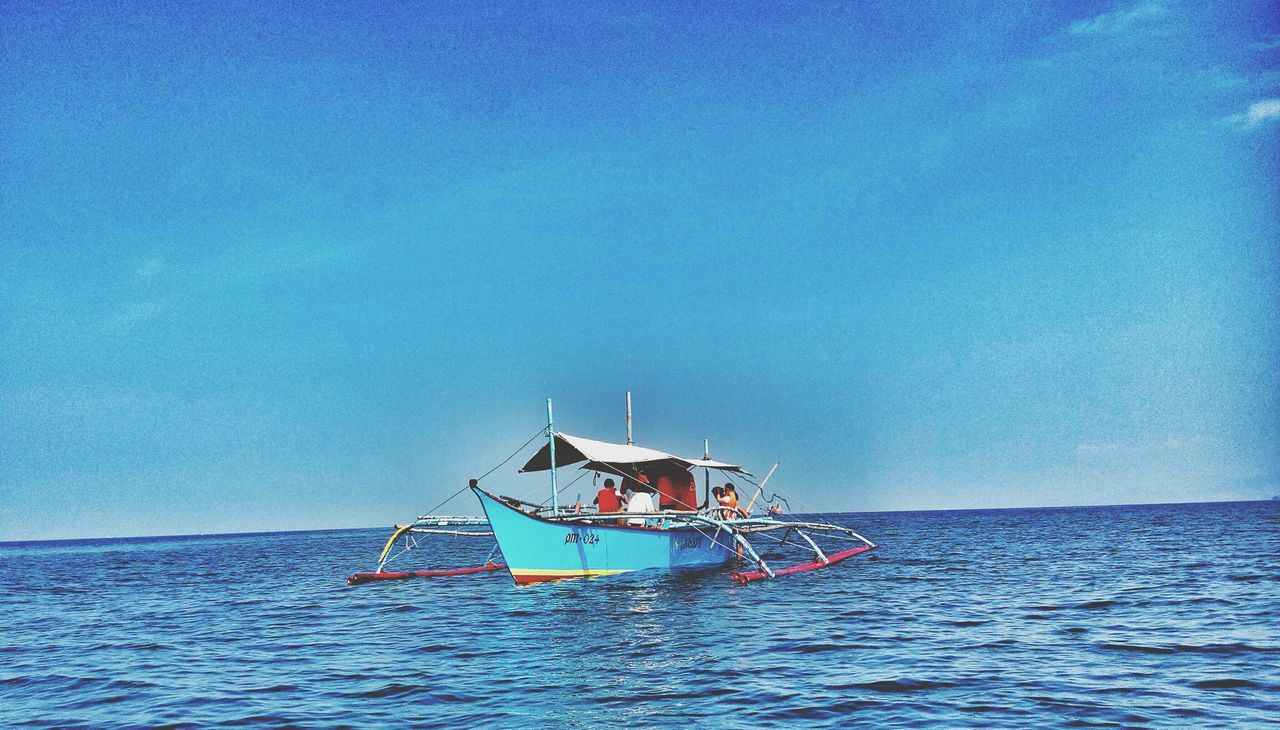 nautical vessel, transportation, mode of transport, boat, sea, water, waterfront, blue, horizon over water, sailing, tranquility, copy space, tranquil scene, clear sky, sky, nature, scenics, moored, beauty in nature, travel