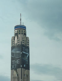 Low angle view of building against cloudy sky