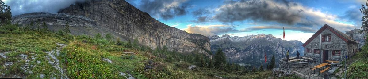 Panoramic shot of mountain range against cloudy sky