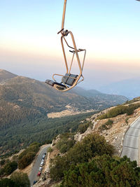 High angle view of cars on landscape against sky